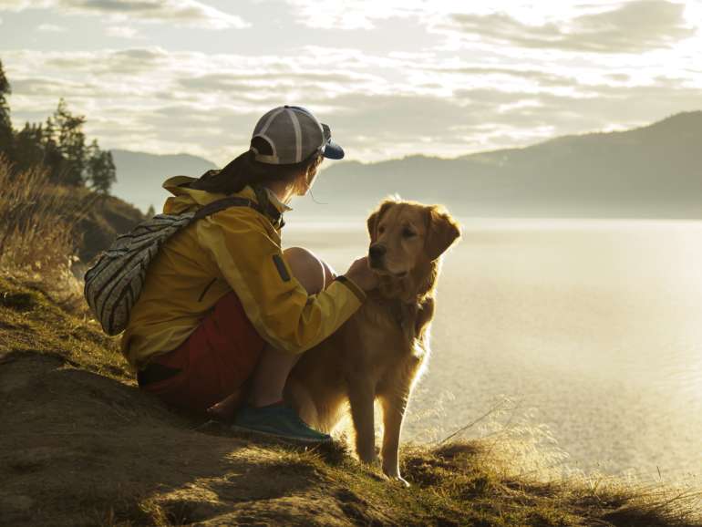 Girl and dog hiking by Timberlake
